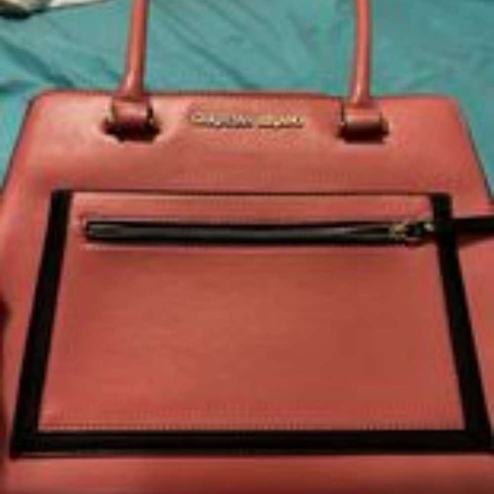 A pink Christian Siriano purse
